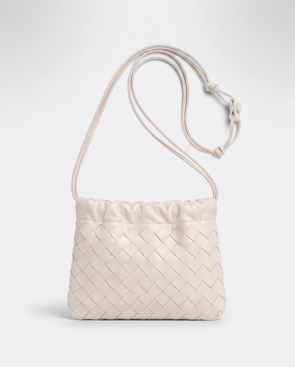 Serata woven leather clutch in Ivory – front view