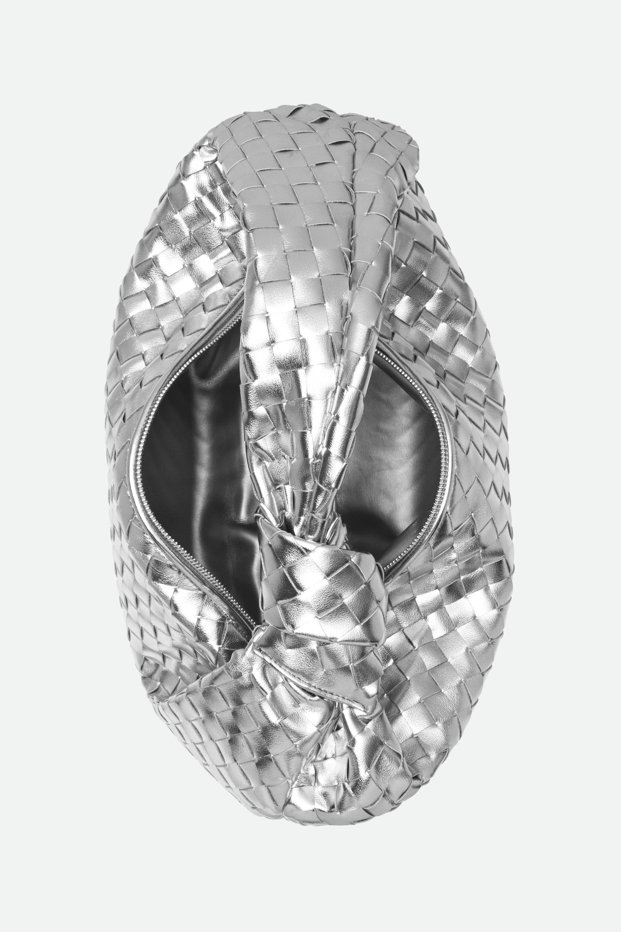 Silver woven handbag with a knotted handle on a white background