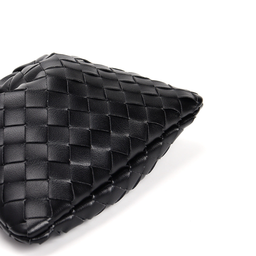 Slim Clutch (Andiamo) genuine leather woven bag in black - texture close-up