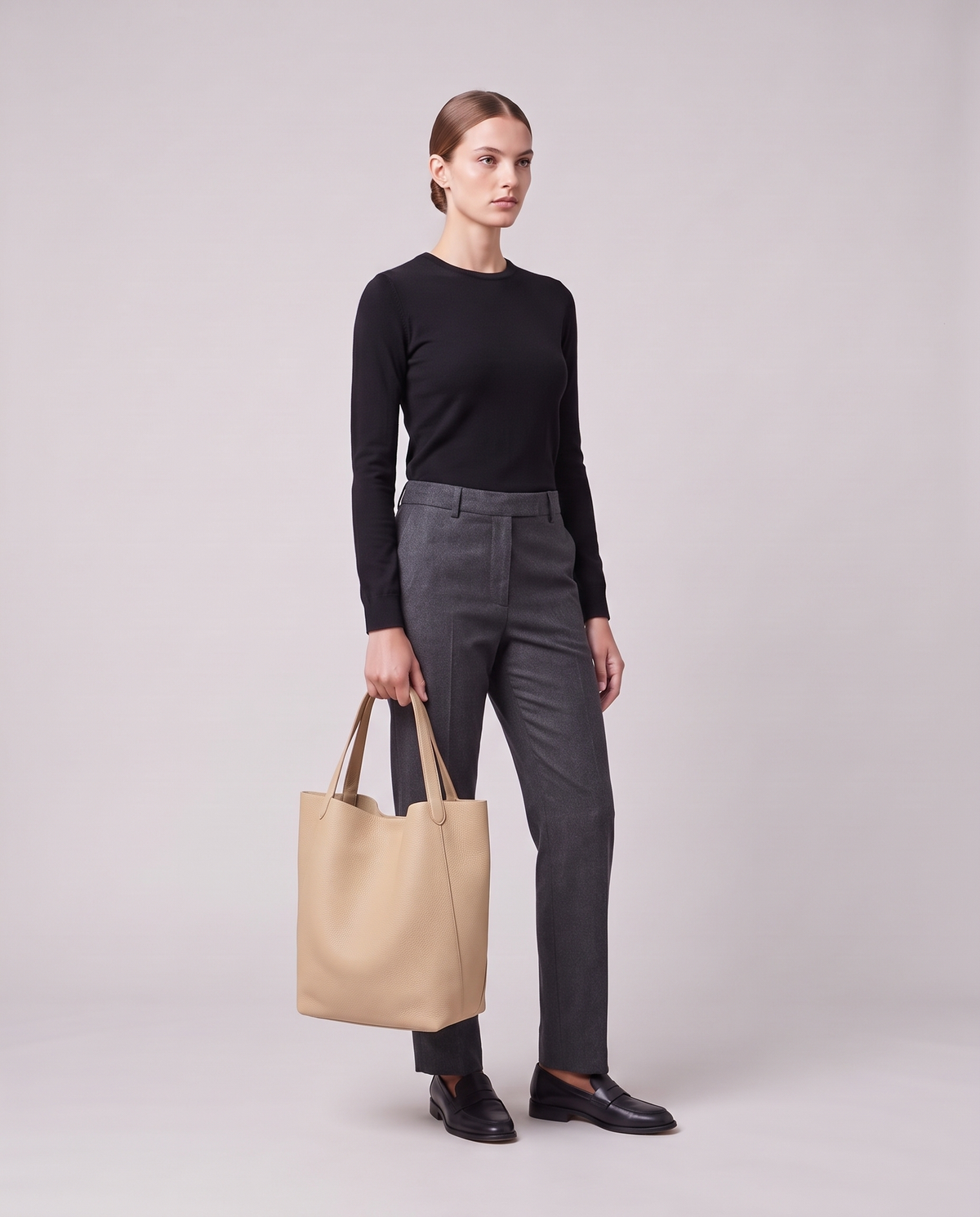 Model holding the Valentina Tela Large bag in Beige, full length