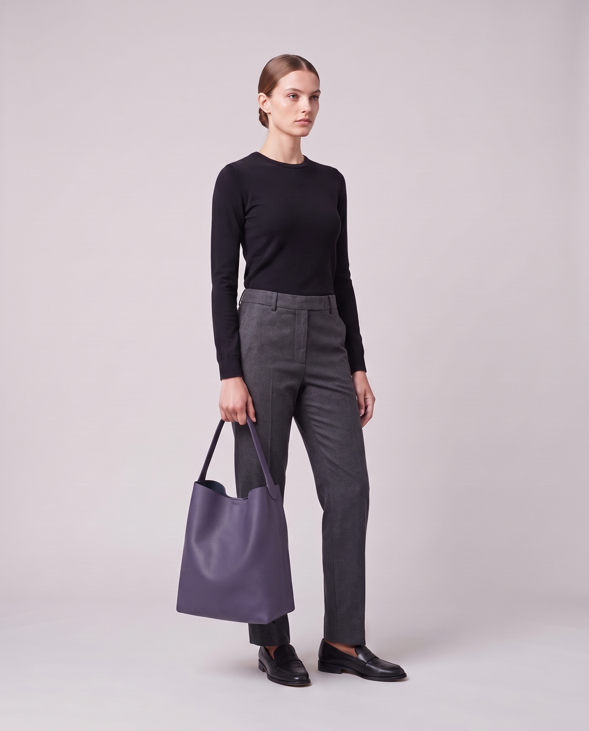 Model holding the Valentina Tela Large bag in Purple, full length
