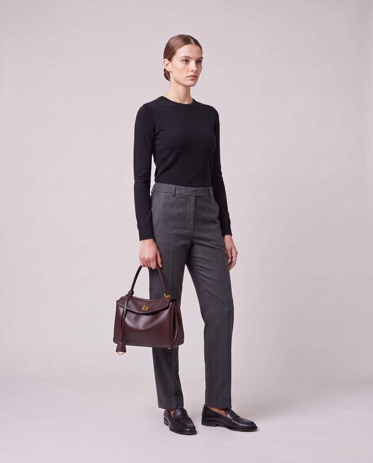 Model holding the Valentina Tinto Large bag in Mahogany, full length