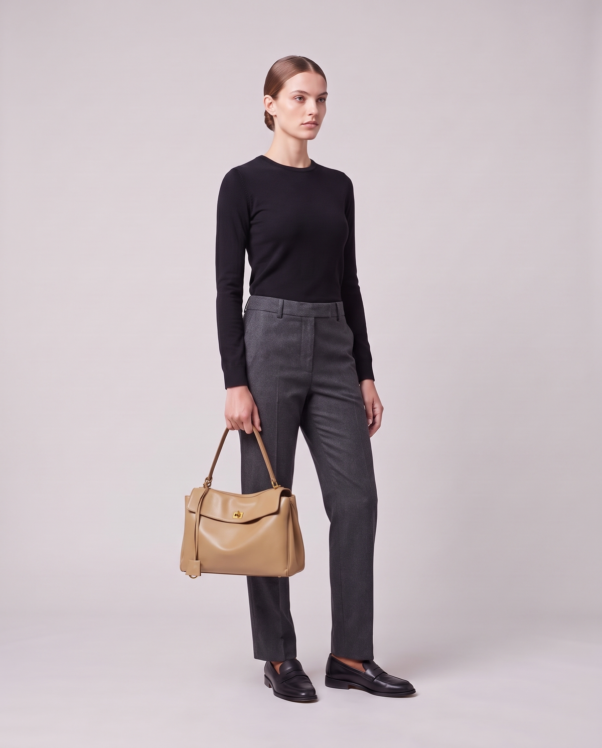 Model holding the Valentina Tinto Large bag in Tan, full length
