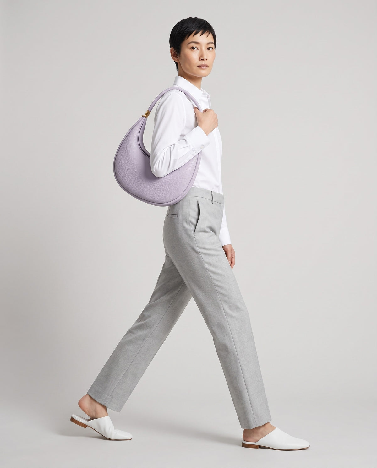 Model wearing the Todi crescent bag in Lavender – full-length view