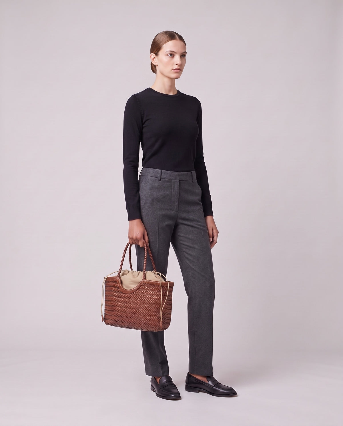 Model holding the Valentina Gubbio bag in Cognac, full length