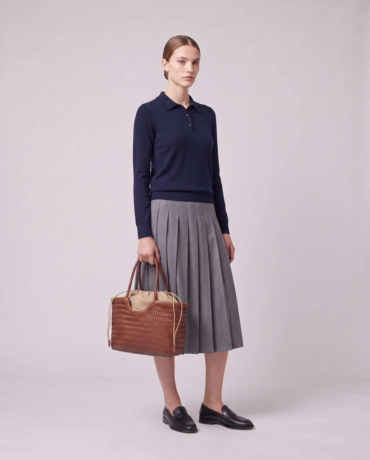 Model holding the Valentina Gubbio bag in Cognac, full length