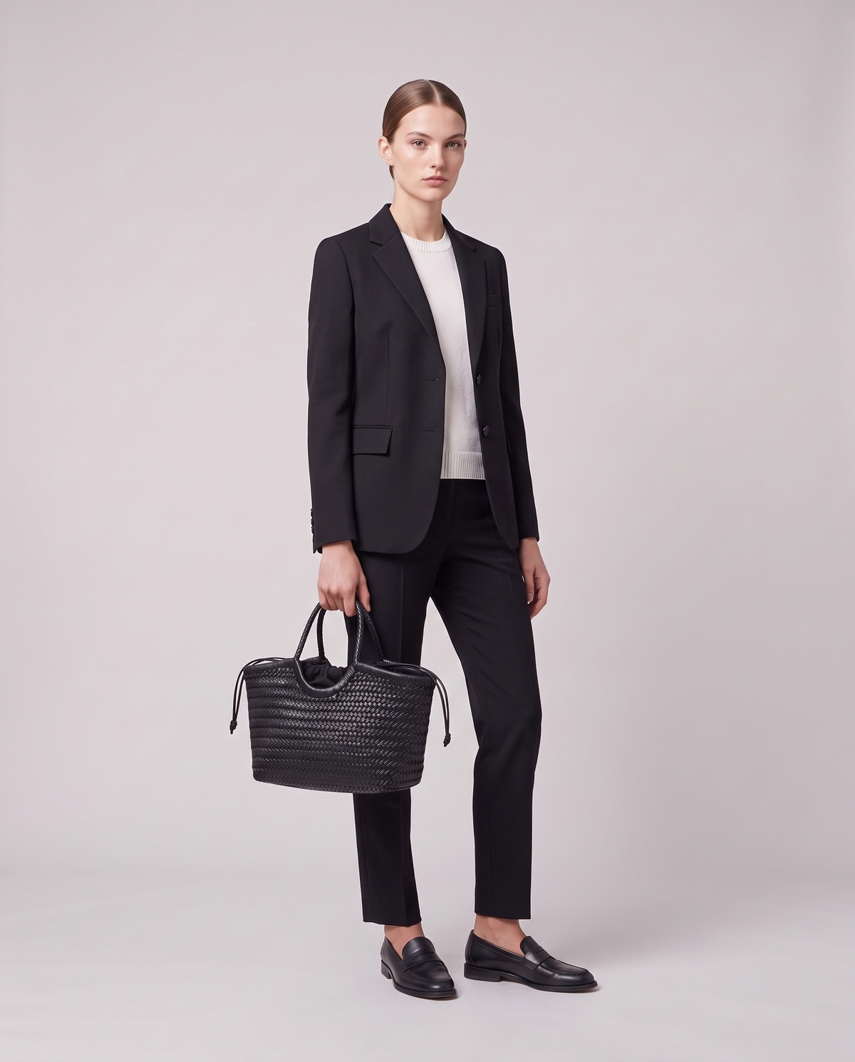 Model holding the Valentina Matera Large bag in Black, full length