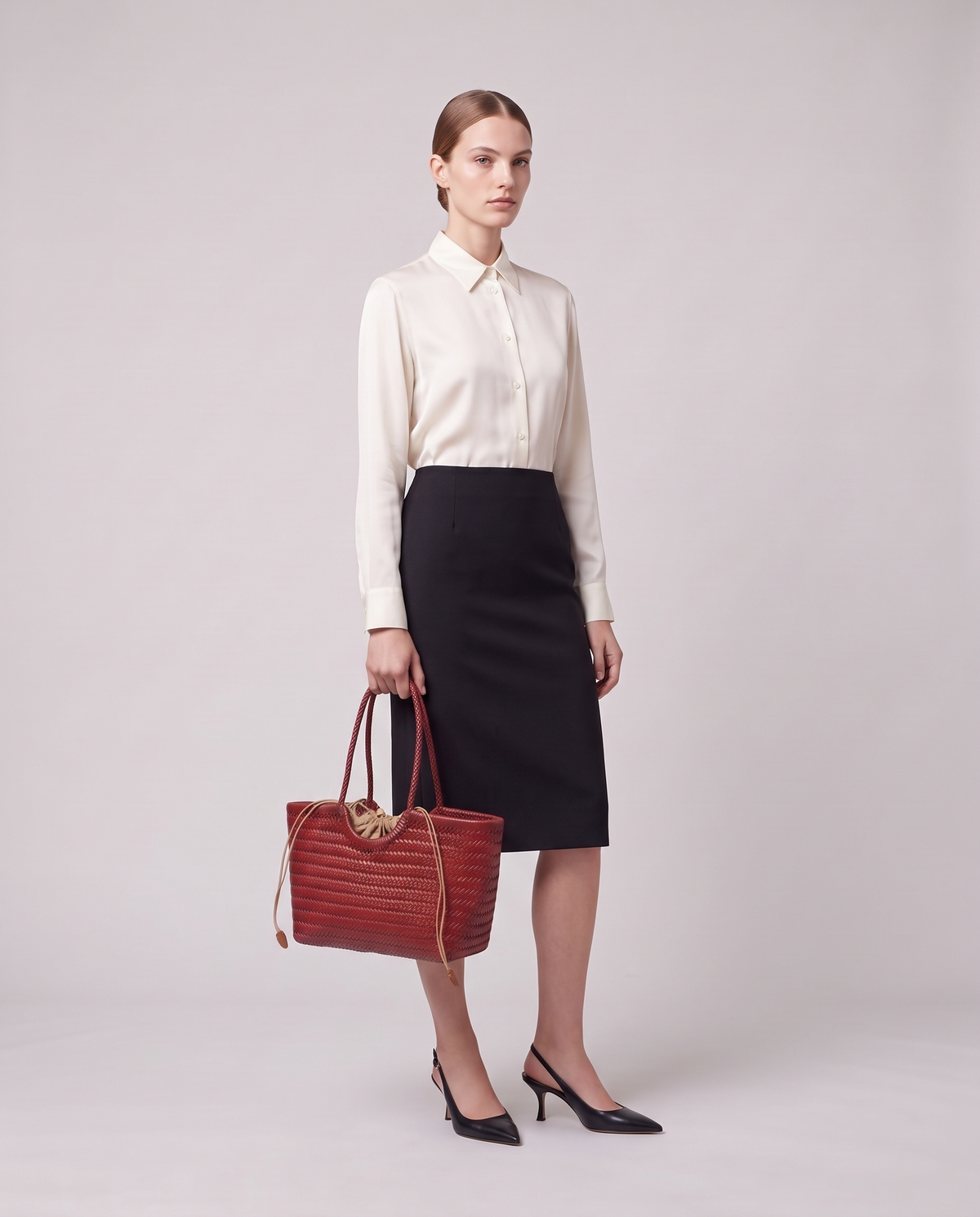Model holding the Valentina Matera Large bag in Red, full length