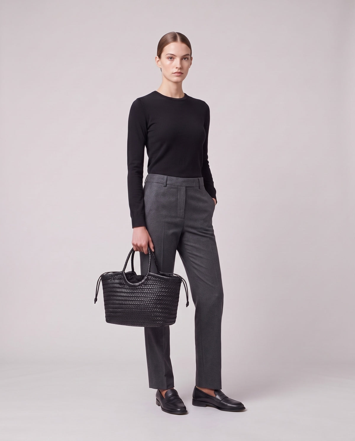 Model holding the Valentina Matera Small bag in Black, full length