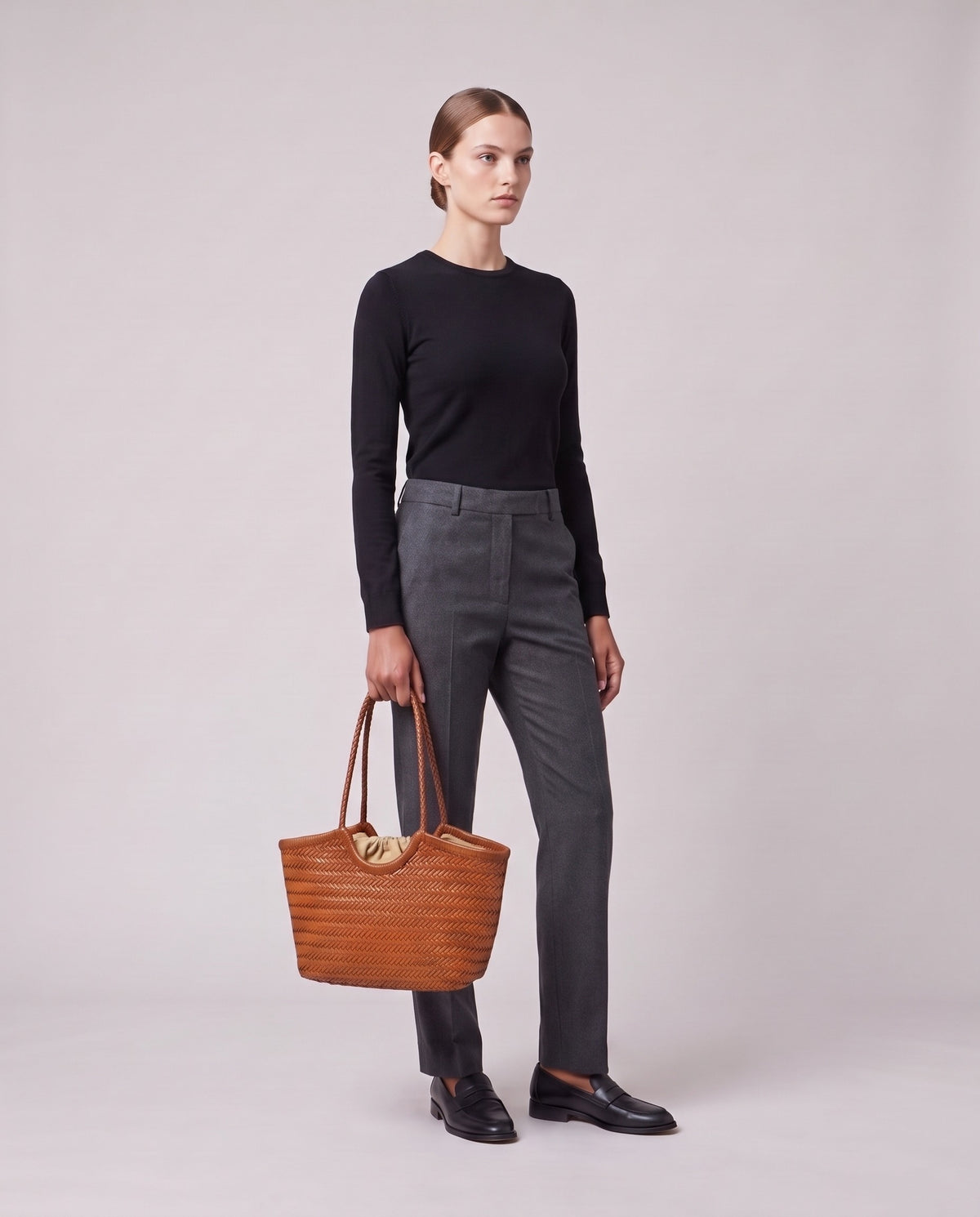 Model holding the Valentina Matera Small bag in Caramel, full length