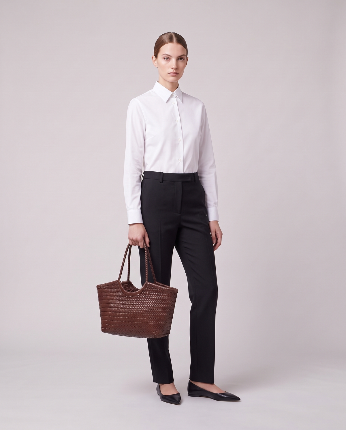 Model holding the Valentina Matera Small bag in Chocolate, full length