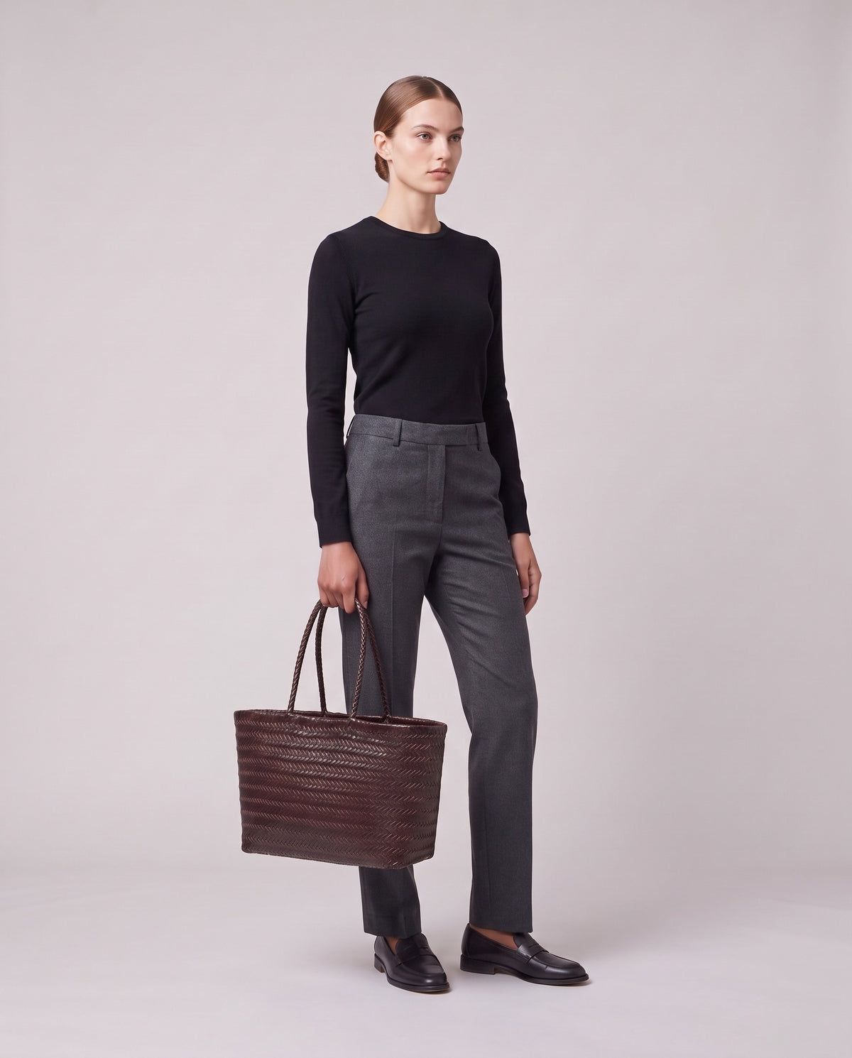 Model holding the Valentina Noto Large bag in Burgundy, full length