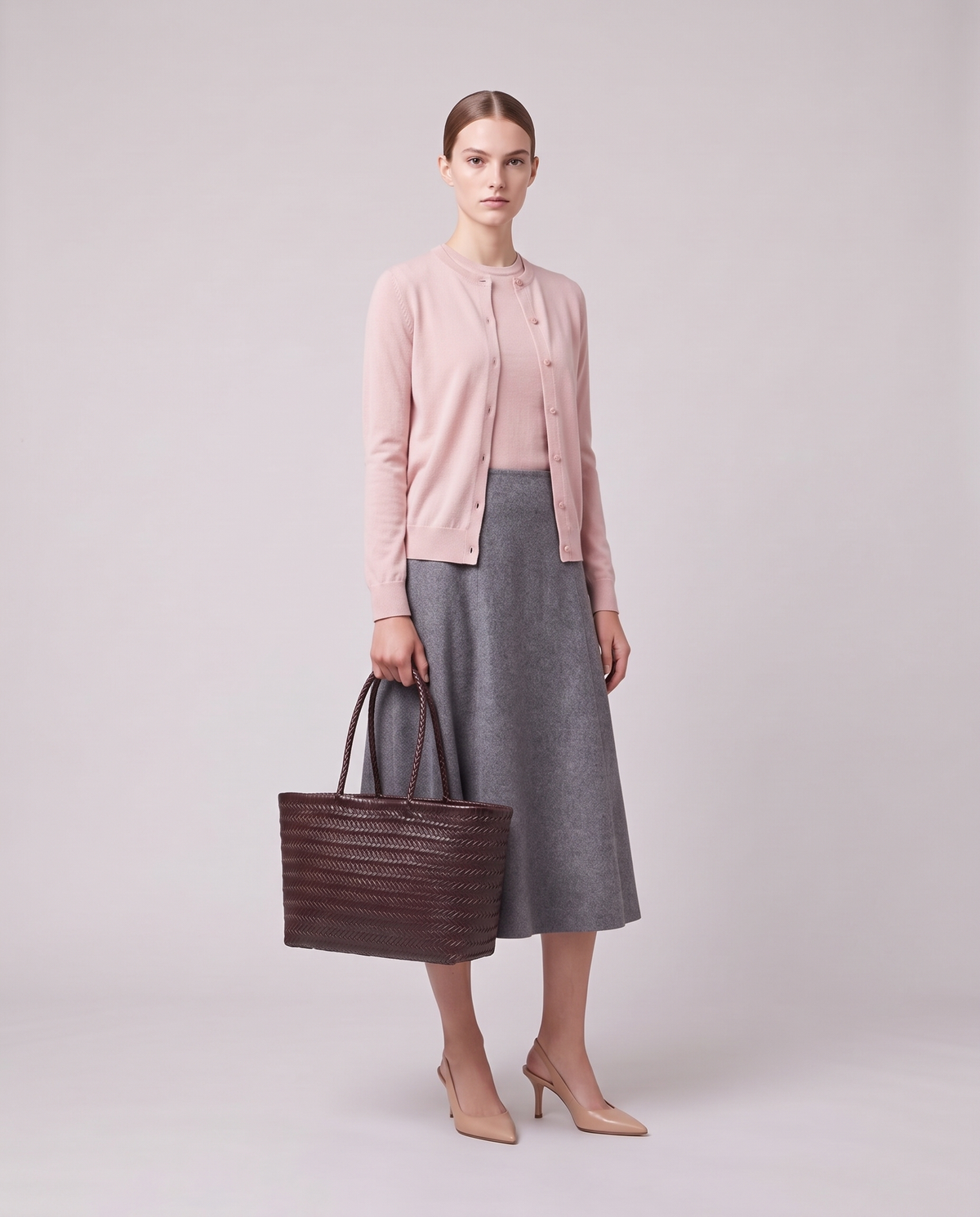 Model holding the Valentina Noto Large bag in Burgundy, full length