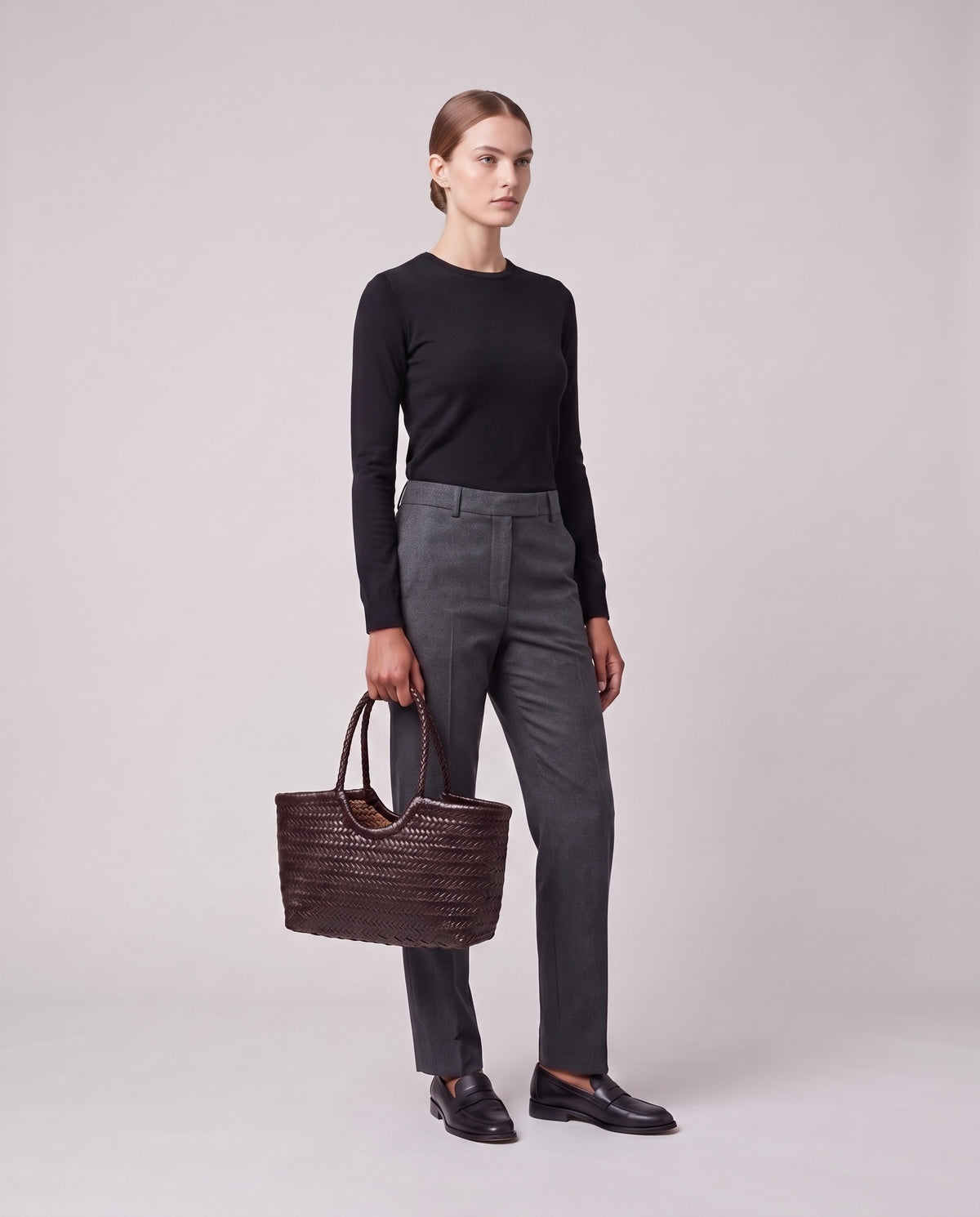 Model holding the Valentina Noto Large bag in Chocolate, full length