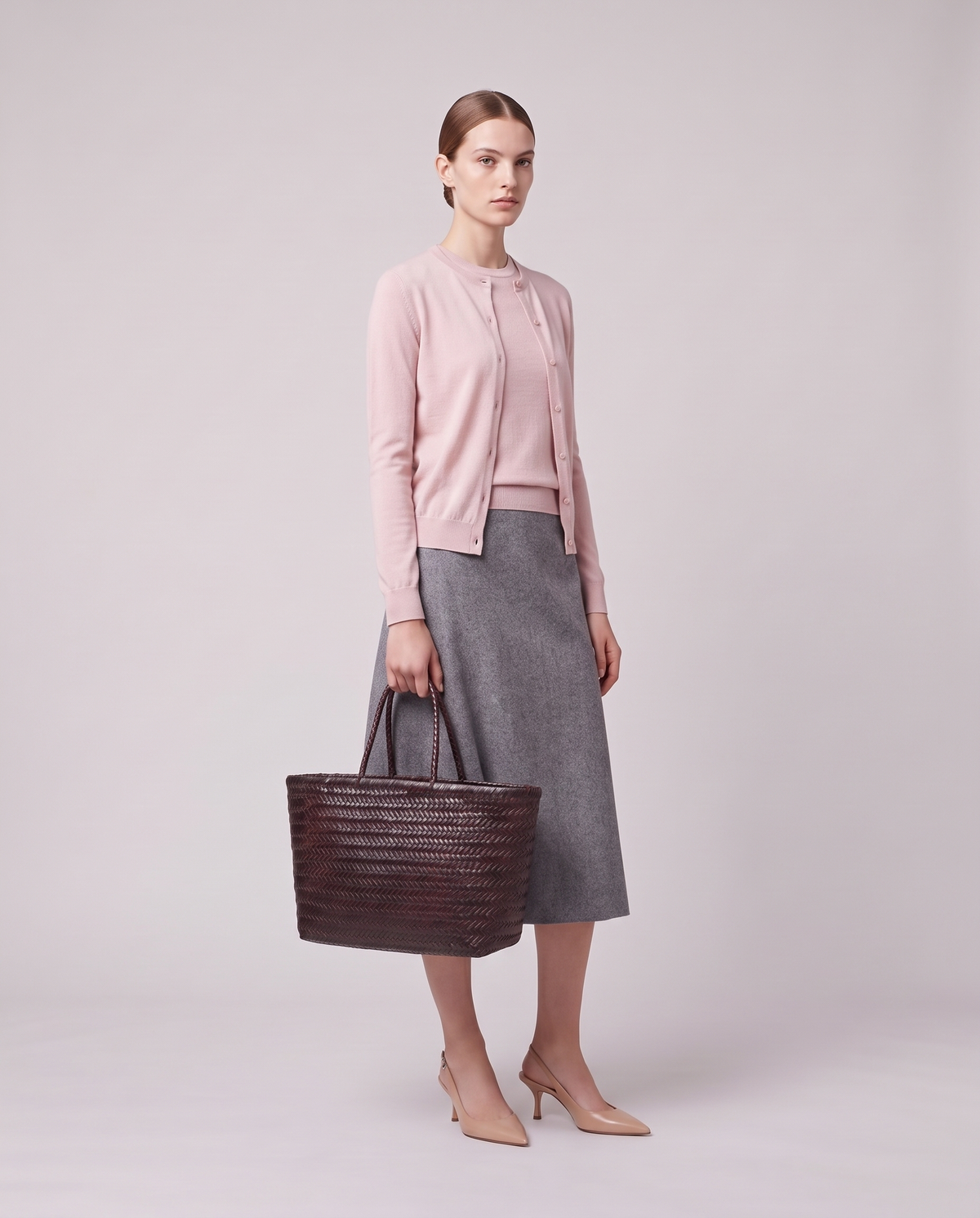 Model holding the Valentina Noto Large bag in Espresso, full length