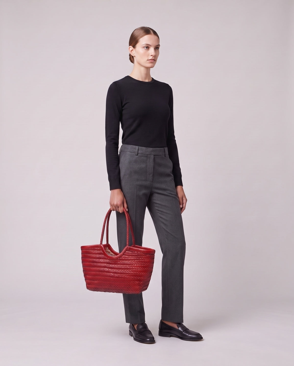 Model holding the Valentina Noto Large bag in Red, full length