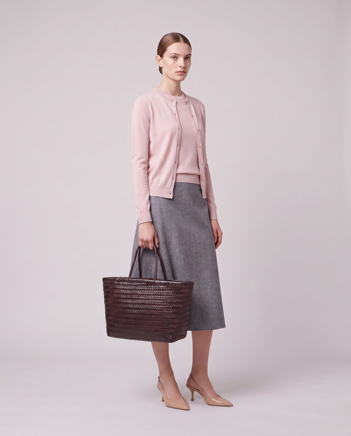 Model holding the Valentina Noto Small bag in Espresso, full length