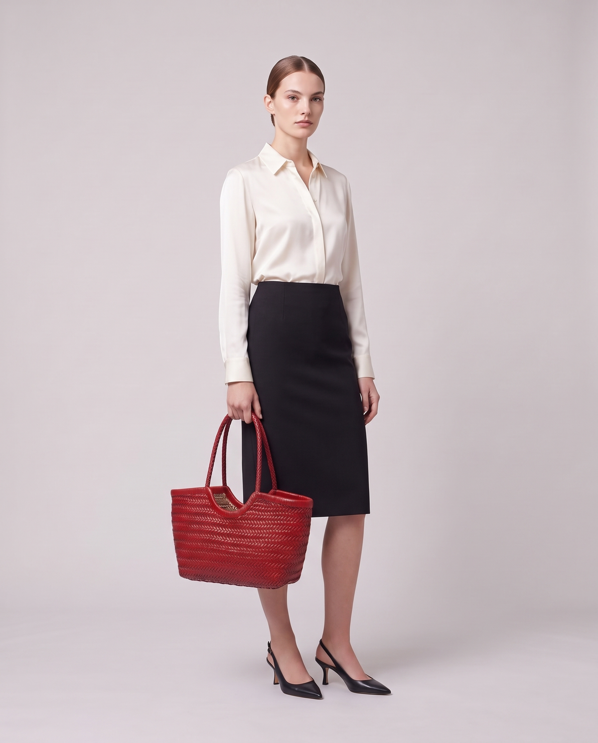 Model holding the Valentina Noto Small bag in Red, full length