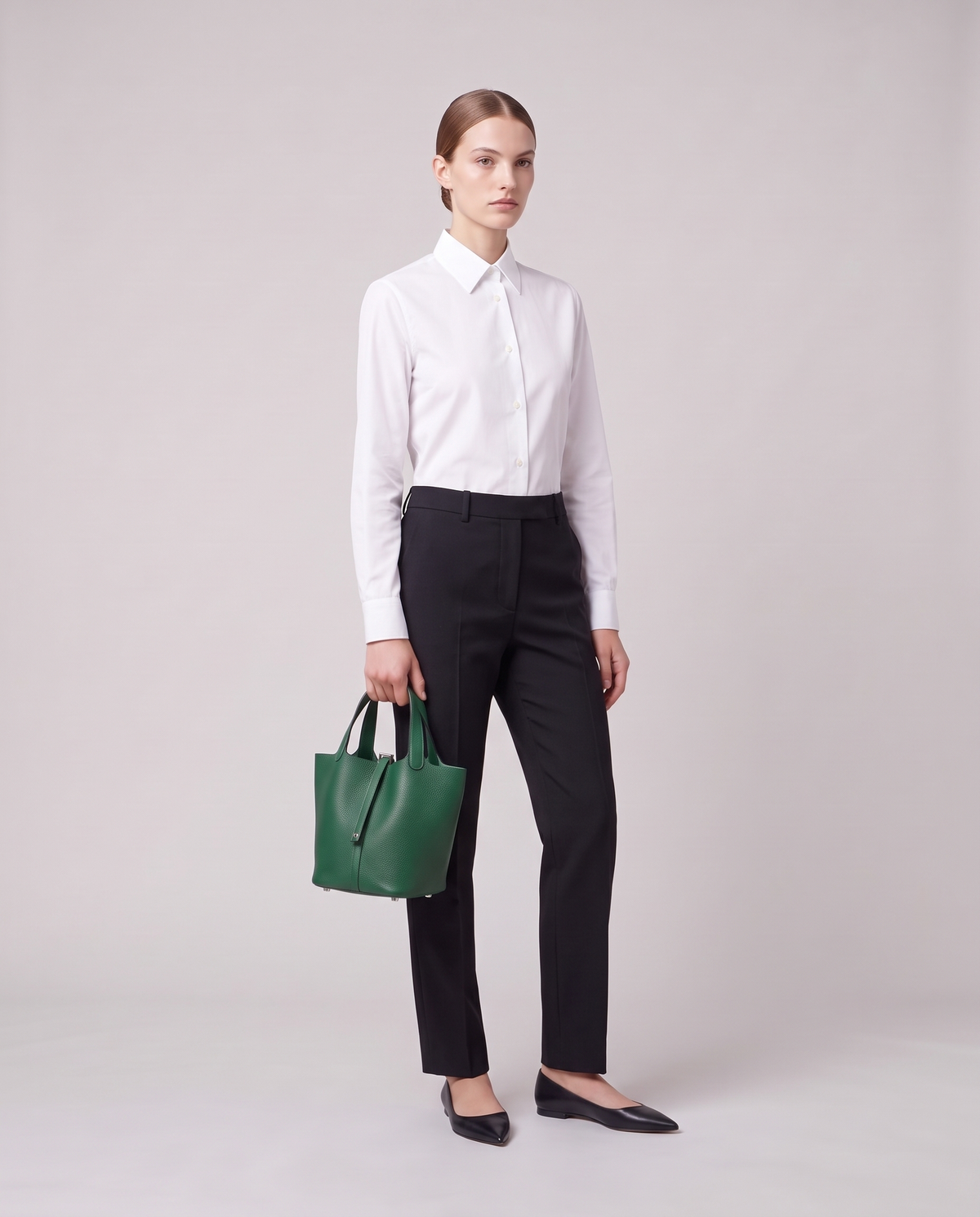 Model holding the Valentina Ostuni Large bag in Emerald, full length