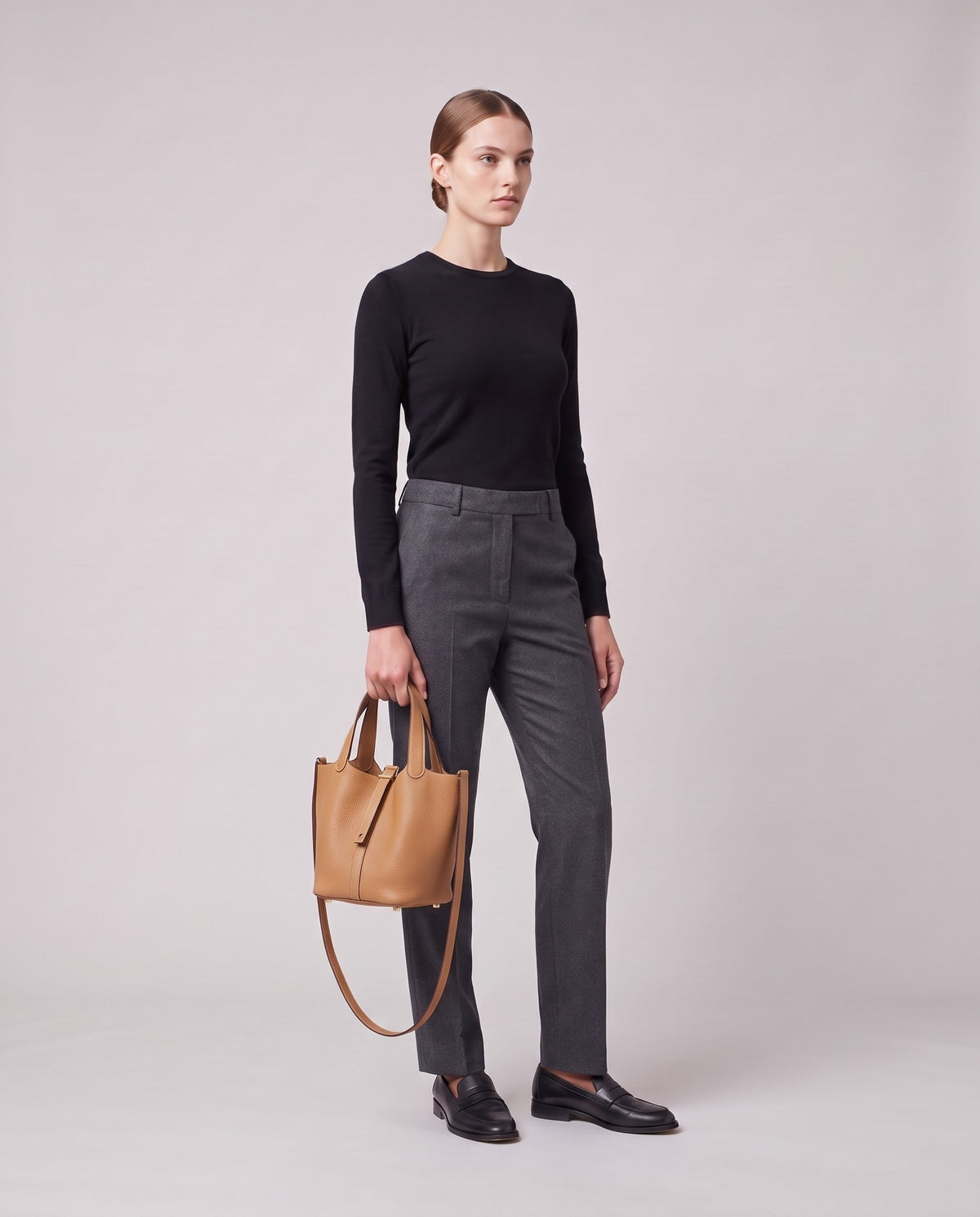 Model holding the Valentina Ostuni Large bag in Tan, full length