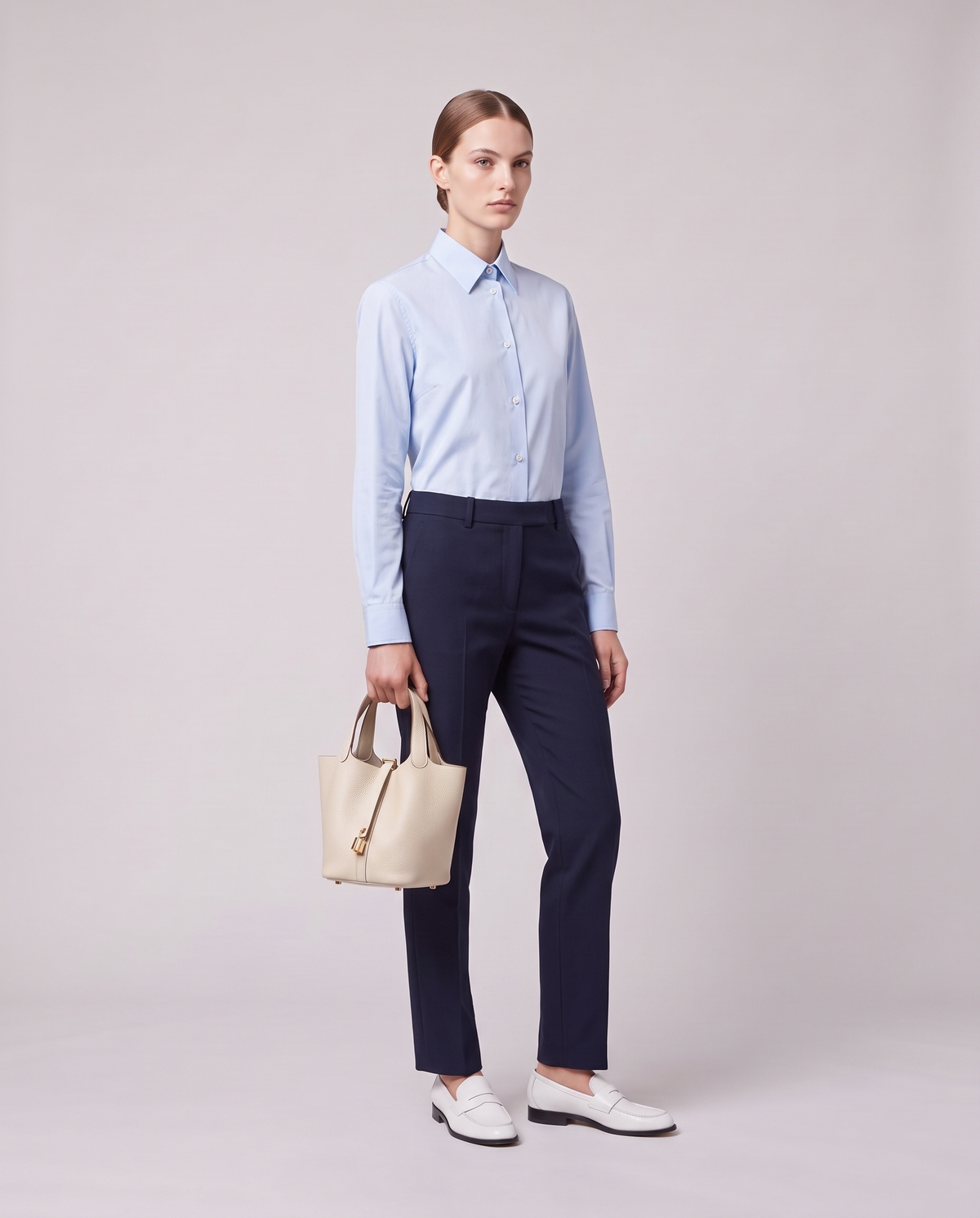 Model holding the Valentina Ostuni Small bag in Ivory, full length