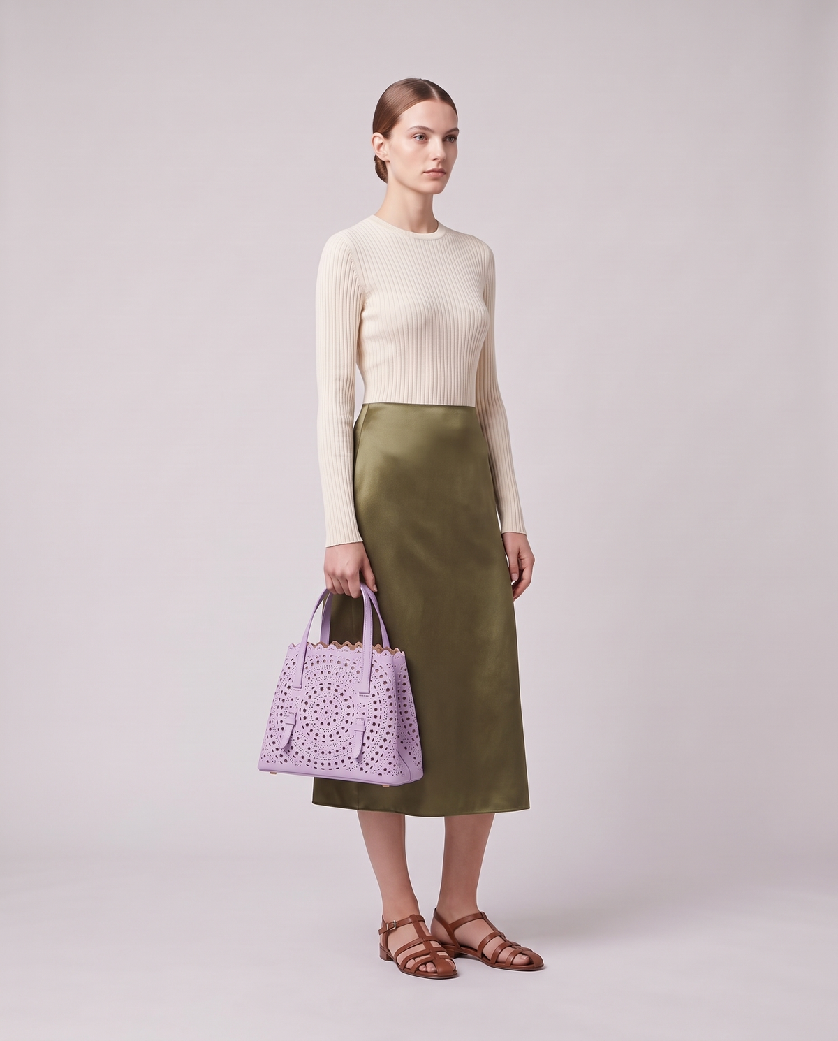 Model holding the Valentina Urbino Large bag in Lavender, full length