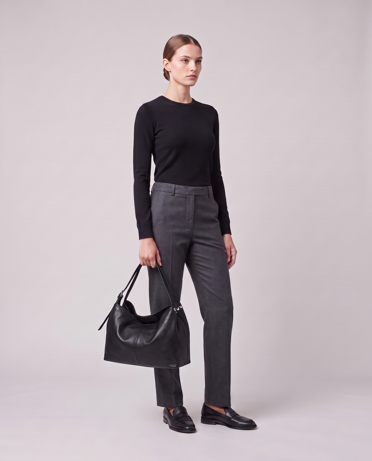 Model holding the Valentina Velluto Large bag in Black, full length