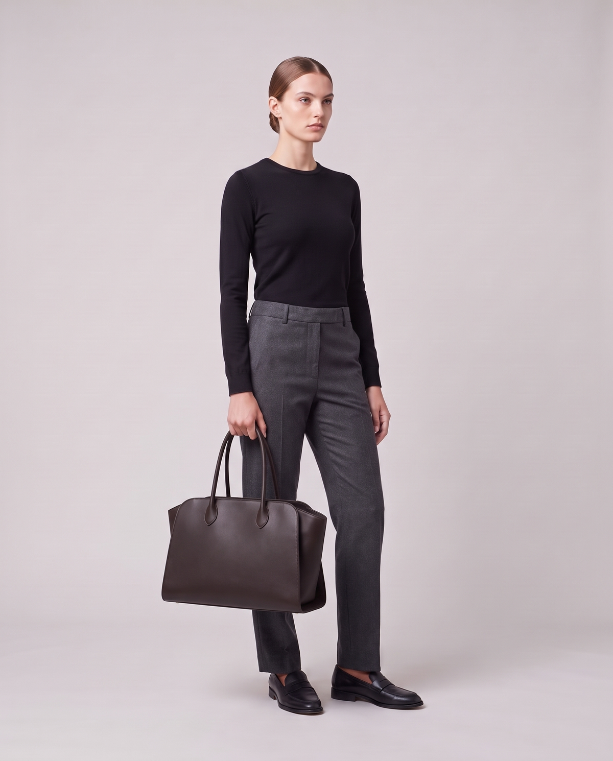 Model holding the Valentina Volta Large bag in Espresso, full length