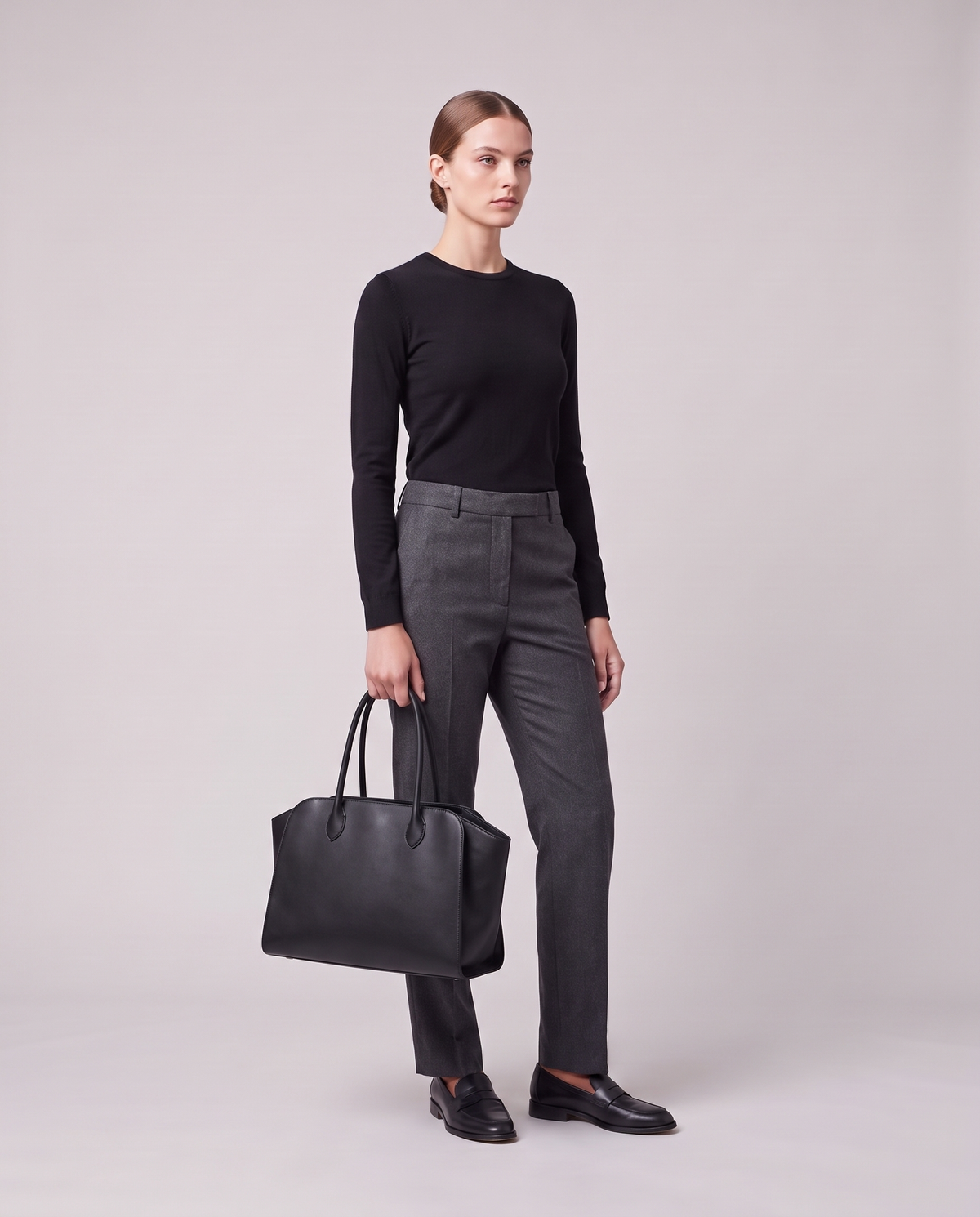 Model holding the Valentina Volta Large bag in Onyx, full length